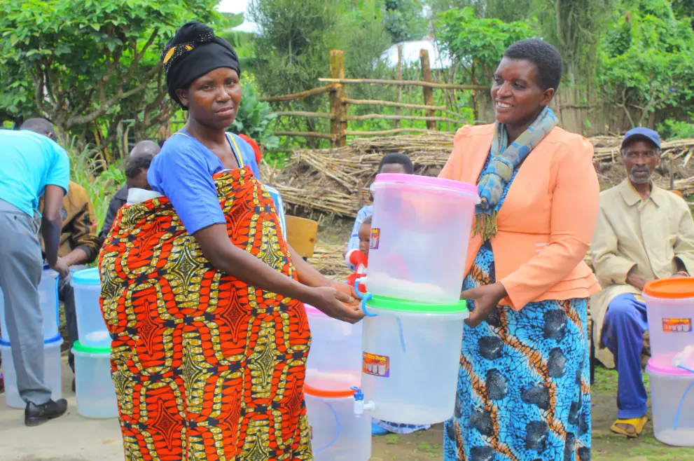 Mighty Water filter distributed to a woman in Rwanda
